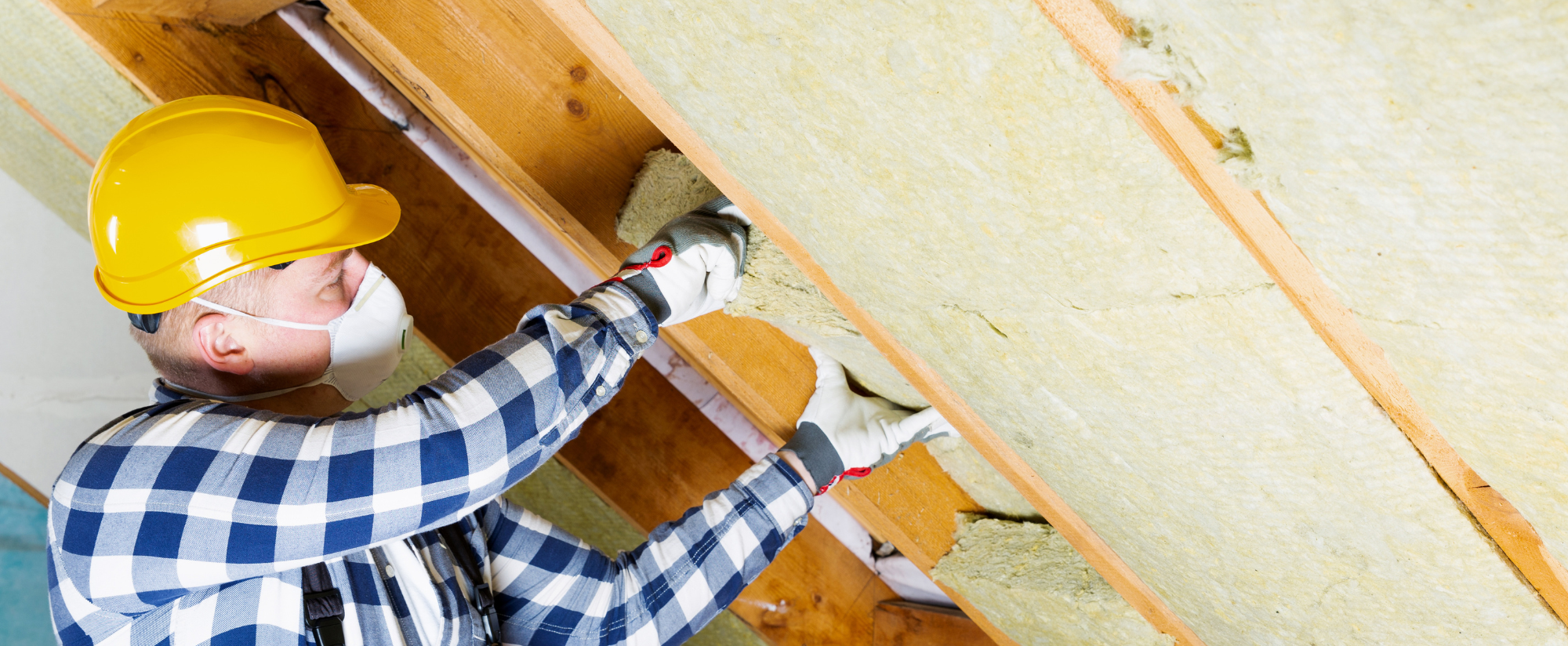 worker installing insulation